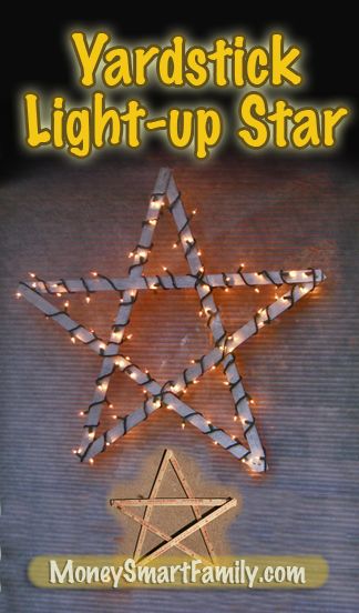 Yardstick star Christmas craft with lights wrapped on it in a window.