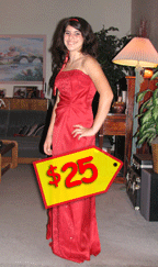 Abbey Economides modeling a red prom gown with a $25 price tag on it.