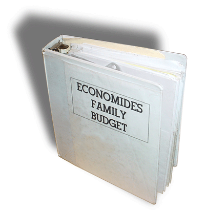 Large white 3-ring binder with the words Economides Family Budget on the cover.