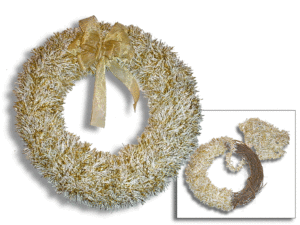 A gold and white tinsel wreath with a golden bow next to a half completed wreath wrapped around brown grapevines.