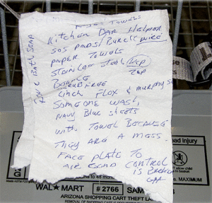 A shopping list written on a napkin.