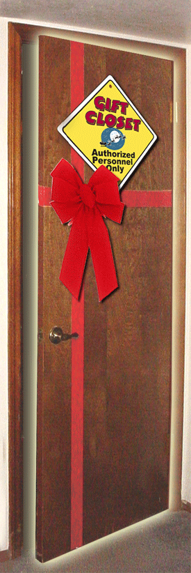 The Gift Closet. A brown oak door with a red ribbon on it and a yellow caution sign.