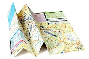 A folded road map on a table.
