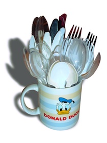 A Donald Duck coffee cup with plasticware stacked in it.