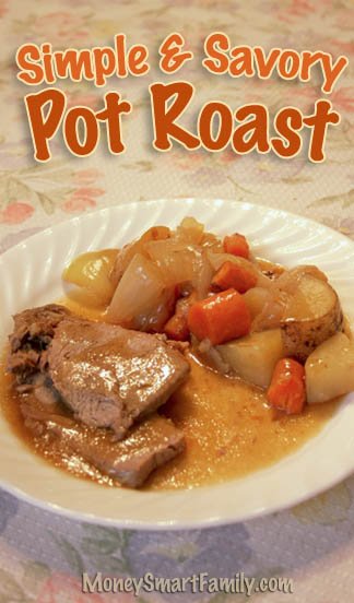 White plate with pot roast, potatoes, carrots and onions.