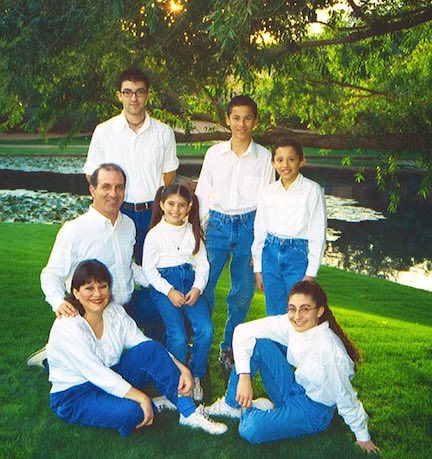 About Steve & Annette and MoneySmart Family 2 Economides Family 2003 in blue jeans at a lake.