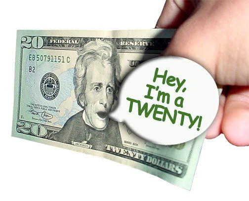 A $20 bill in a man's hand.