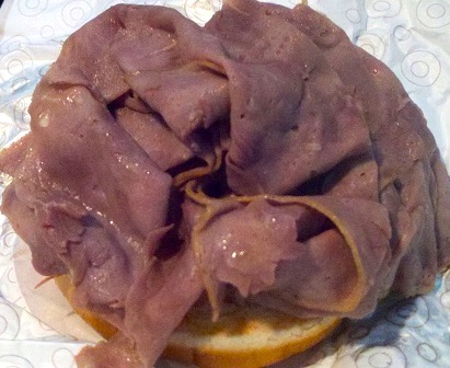 Arby's Roast Beef sandwich open face with no top bun.