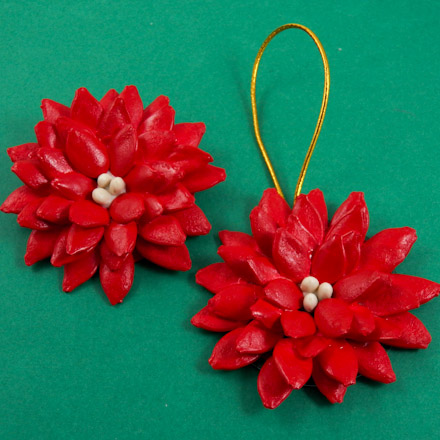 10 Stunning & Fun, Budget-Friendly DIY Christmas Craft Ideas 14 Aunt-Annie's Pointsettia Christmas Ornament made from pumpkin seeds