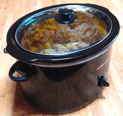 10 Unique Family Recreation Ideas—Save Money, Have Fun 3 A black crockpot with beef stew in it.