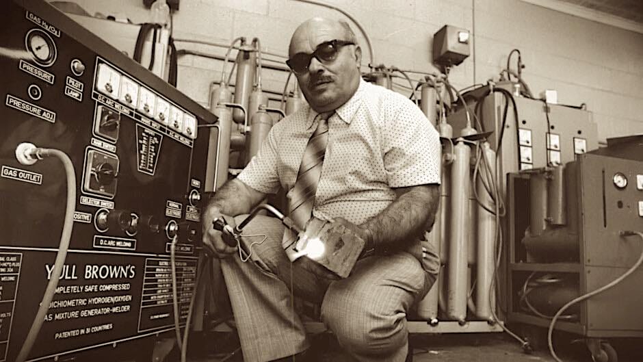 Dr Yull Brown with his Brown's Gas Generator - photo courtesy of https://trakiaworld.com/
