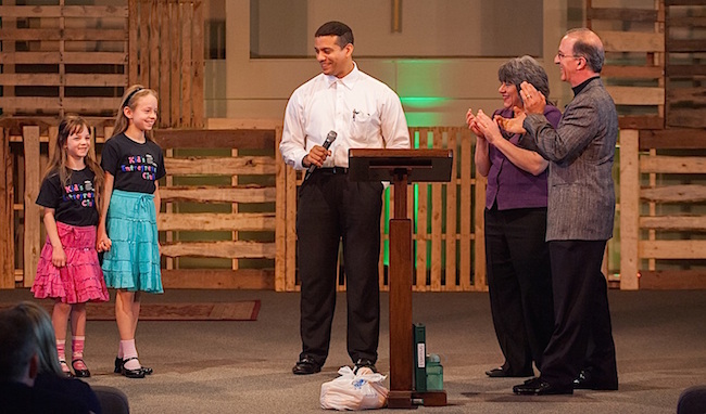 Entrepreneurship For Kids - Easy Ideas for Kids Starting Their Own Businesses 2 Two entrepreneurial girls presenting their baking business on stage.
