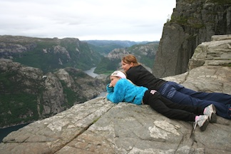 GirlsLayingOnRock-freeimages.com:802010_74703423Small Two girls on vacation laying on the edge of a canyon. Enjoying life because their parents became debt free by using a budget.
