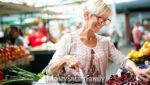 Grocery Stores with Senior Discounts - Woman selecting fruits and veggies