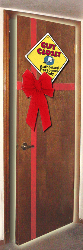 Christmas on a Small Budget—30 Ideas For A Magical Holiday 3 The Gift Closet. A brown oak door with a red ribbon on it and a yellow caution sign.