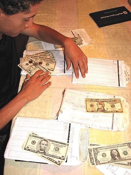 Summer Jobs for Teens: Finding Work & Earning Money 10 Joe managing his budget with cash envelopes