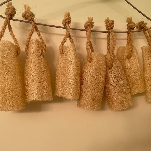 Luffah sponges haning on a string.