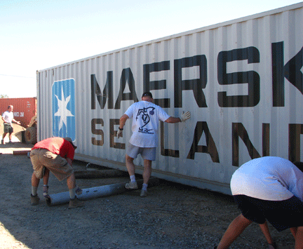 Family Teamwork: How to Accomplish More, Faster, Working Together 8 A team of kids moving a storage container.