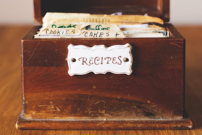 An old wooden recipe box for cooking.
