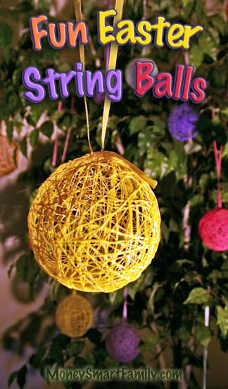 11 Fun Easter Traditions for Families: Crafts, Decor, & Activities for a Great Celebration 3 A Yellow string ball hanging from a yellow ribbon on a ficus tree, decorated for Easter.
