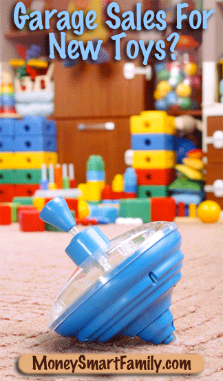 A colorful blue top sitting on a beige carpet in front of a pile of colored building blocks.