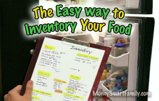 Hand holding a clipboard to inventory the food in a refrigerator