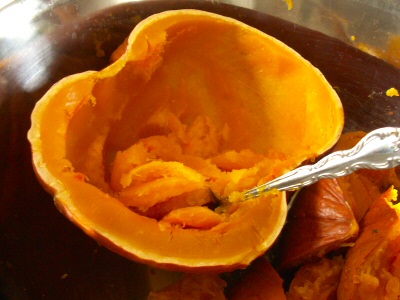 Save Money on Fruits & Veggies - Produce Savings 16 Cooked Pumpkin scooping out the meat.