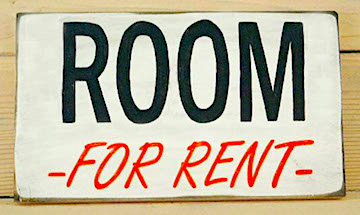 Room for rent sign on the side of a house.
