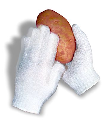 Gloved hands scrubbing a potato.
