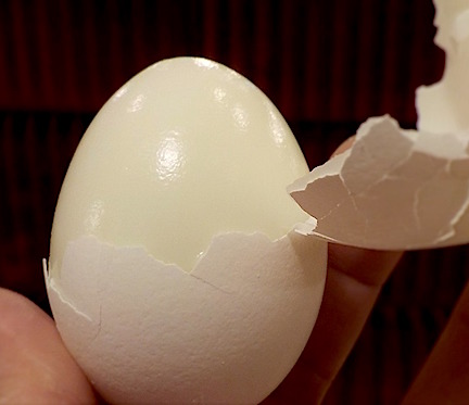 A peeled hard-boiled egg for a snack.