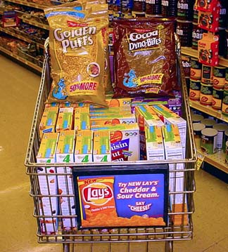 15 Ways to Wreck Your Food Budget 6 Grocery cart full of discounted cereal.