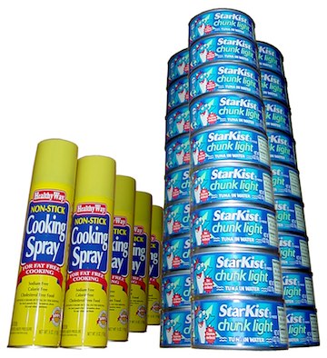 A stack of blue tuna cans next to a row of cooking spray - stock up and save.