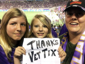 Veterans: How to get Free Event Tickets with VetTix! 5 Family holding a sign saying "thanks VetTix."