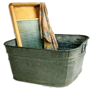 An old-fashioned washboard in a tub of water.