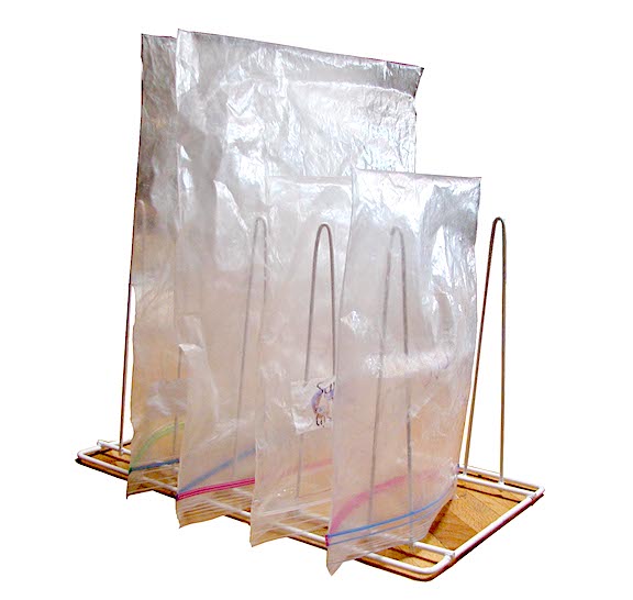 Which Dish Soap is Cheapest & Best: Dawn, Ajax or Walmart? 3 Ziplock bags on a drying rack.