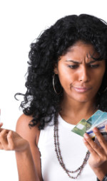 A woman with two hands full of credit cards trying to decide which one to use.