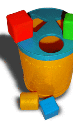 A child's toy: Yellow plastic cylinder with a blue lid and colored blocks.
