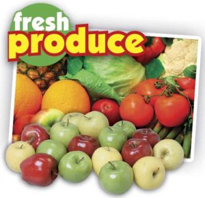 Fresh fruits and veggies pouring out of a grocery bag.