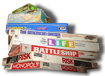 A stack of board games including Monopoly, Risk, Battleship and Life.