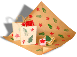 Brown paper wrapping paper stamped with red stars and green Christmas trees.