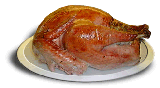 A roasted turkey sitting on a white platter.