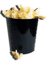 A black trash can full of crumpled yellow paper.