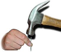 Hammer hitting the pointed end of a nail.