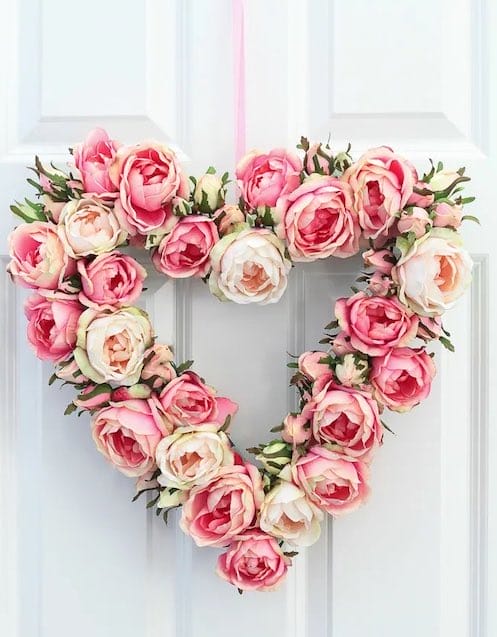 Valentine's Day dried flower wreath haning on a front door.